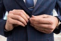 Man hands fastening business suit jacket button Royalty Free Stock Photo