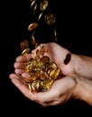 Man Hands full of money receiving a Rain of Coins Royalty Free Stock Photo