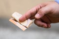 Man hands giving money like a bribe or tips. Holding EURO banknotes on a blurred background, EU currency Royalty Free Stock Photo