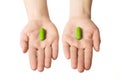 Man hands giving two big blue pills. Make your choice of healthcare. Herbal consept.