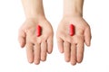 Man hands giving two big red pills. Make your choice consept. excitation and adrenalin