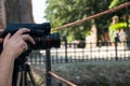 Man hands grabbing camera while taking pictures Royalty Free Stock Photo