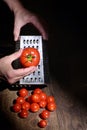 A Man Hands Grinds Tomato On A Grater