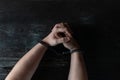 Hands in handcuff on table Royalty Free Stock Photo