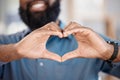 Man, hands and heart with gesture in closeup, alone and blurred background. African, person or model with love, hope or