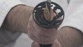 Man hands hold Japanese katana with ornamental black tsuba