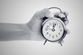 Man hands holding big round clock