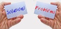 Man hands holding cards with the words problems and solutions Royalty Free Stock Photo
