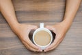 Man hands holding coffee cup in heart shape Royalty Free Stock Photo