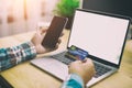 Man hands holding Credit card and phone,laptop with shoping online