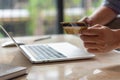 man hands holding credit card using internet payment laptop computer, online shopping digital banking, Business financial Royalty Free Stock Photo