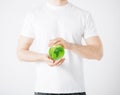 Man hands holding green sphere globe Royalty Free Stock Photo