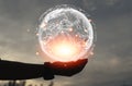 Man hands holding hologram, global network on a nature background. Creativity and modern concepts