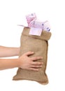 Man hands holding money bag full with euro bills Royalty Free Stock Photo