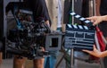 Man hands holding movie clapper. Film director concept. Behind the scenes of movie shooting or video production and film crew team