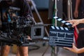 Man hands holding movie clapper. Film director concept. Behind the scenes of movie shooting or video production and film crew team