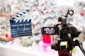 Man hands holding movie clapper.Film director concept.camera show viewfinder image catch motion in interview or broadcast Christma