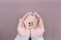 Man hands holding paper house, family home Royalty Free Stock Photo