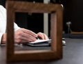 Man hands holding pen and taking notes in notebook. Businessman hand writing in office. Royalty Free Stock Photo