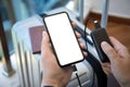 Man hands holding phone with isolated screen and powerbank suitcase