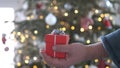 Man hands holding red gift box presents with silver ribbon bow. Concept Season of giving, Christmas, happy new year Royalty Free Stock Photo