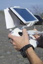 Man hands holding remote controller using tablet for drones flying. Royalty Free Stock Photo