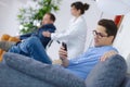 man hands holding smart phone in hospital waiting room Royalty Free Stock Photo