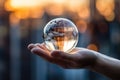 Man hands holding transparent earth globe over blurred background. Generative AI Royalty Free Stock Photo