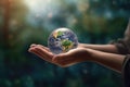 Man hands holding transparent earth globe over blurred background. Generative AI Royalty Free Stock Photo