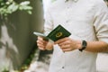 Man hands holding Vietnamese Passport. Ready for traveling. Royalty Free Stock Photo