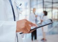 Man hands of hospital doctor with tablet to search through digital medicine clinic medical records, files or documents Royalty Free Stock Photo