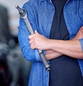 Man, hands and mechanic tool with arms crossed for vehicle repairs, assistance and engineering at garage. Professional