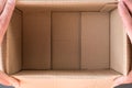 Man hands open empty cardboard box, inside view. Close up Royalty Free Stock Photo