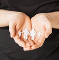 Man hands with paper men Royalty Free Stock Photo