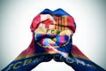 Man hands patterned with the flag of the Futbol Club Barcelona