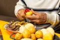 Man hands peeling potato Royalty Free Stock Photo