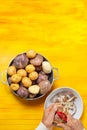 Man hands peeling potato for ajiaco Royalty Free Stock Photo