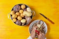 Man hands peeling three different potato types Royalty Free Stock Photo