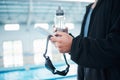 Man hands, phone texting and swimming pool with goggles, water bottle or communication on social media. Aquatic sports Royalty Free Stock Photo