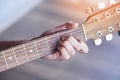 Man hands playing acoustic guitar  close up chord guitar player Musical instrument for recreation or hobby passion concept Royalty Free Stock Photo