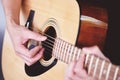 Man hands playing acoustic guitar  close up guitar player Musical instrument for recreation or hobby passion concept Royalty Free Stock Photo