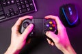 Man hands playing a computer game with a game joystick. Royalty Free Stock Photo