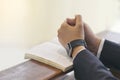 Man hands praying on a holy bible in church for faith concept, Spirituality and Christian religion Royalty Free Stock Photo