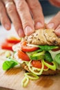 Man hands prepearing sandwich closeup image