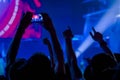 Man hands recording video of live music concert with smartphone Royalty Free Stock Photo