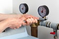 Man hands repairing pressure gauge Royalty Free Stock Photo