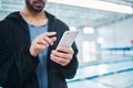 Man hands, smartphone texting and swimming pool with communication, email and social media contact. Aquatic sports coach Royalty Free Stock Photo