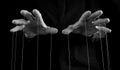 Man hands with strings on fingers. Negative abusive relationship, manipulation, control, power concept. Black and white