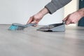 Man hands sweeping Dust with brush and dustpan, Housekeeping concept