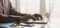 Man hands typing on computer keyboard closeup, businessman or student using laptop at home, panoramic banner